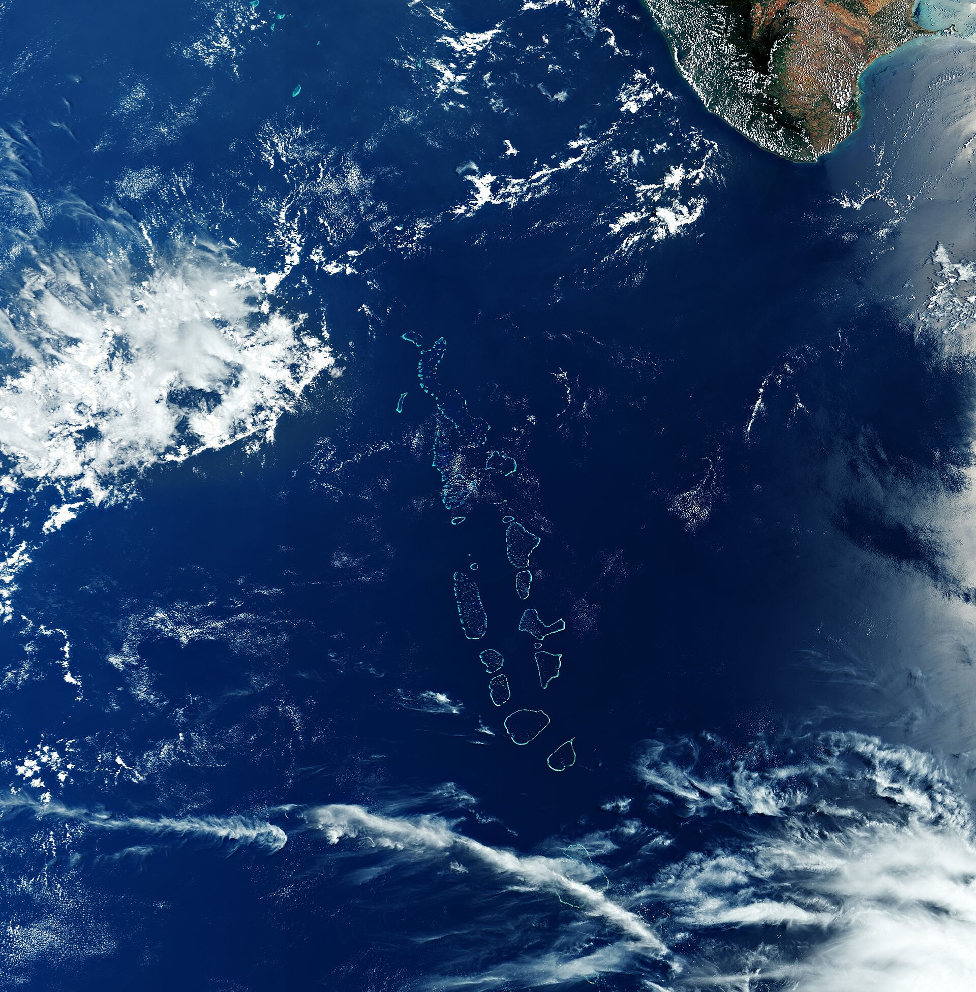 Aerial view of the Maldives' chain of coral atolls across the Indian Ocean